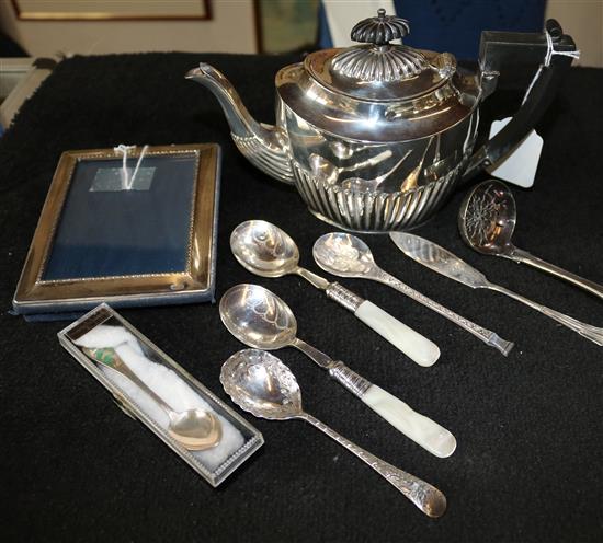 Small quantity of silver and plated flatware, silver photograph frame and a silver teapot